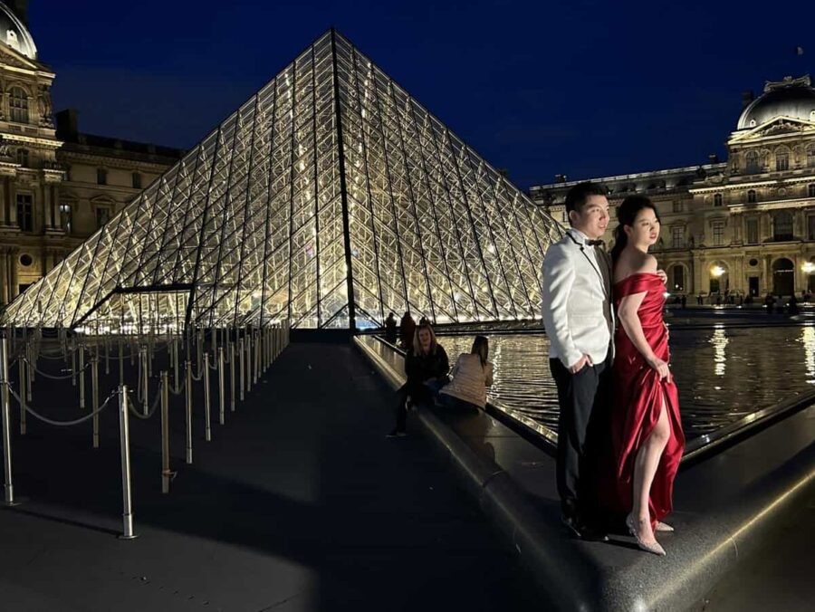 Wedding couple at Louvre Pyramid Paris by night