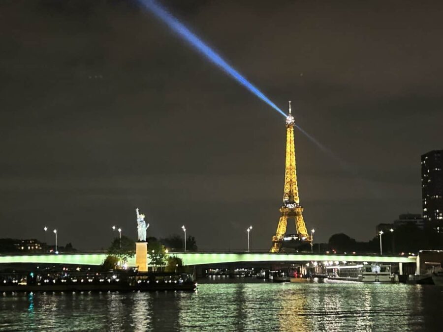 Eiffel Tower by night and Liberty Statue Paris