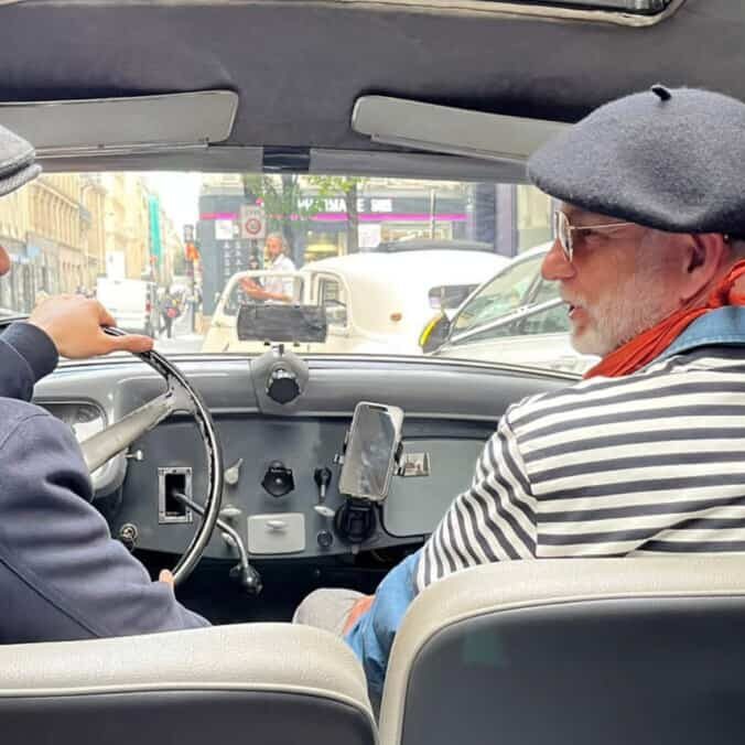 Two French gentlemen speaking in a Citroen Traction 1938