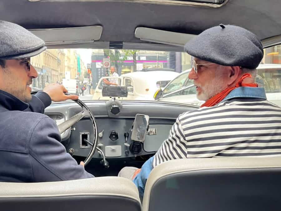 Two French gentlemen speaking in a Citroen Traction 1938